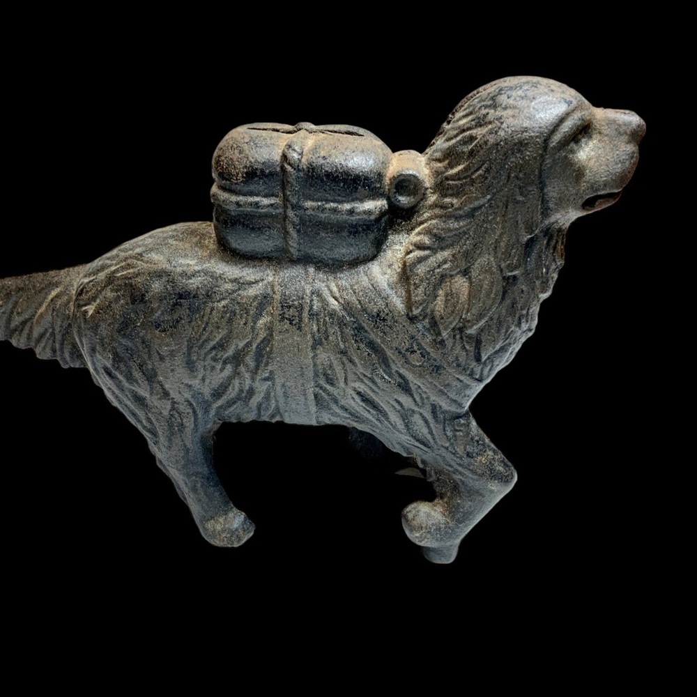 Antique cast iron still bank is A.C Williams Company’s “St.Bernard With Pack”